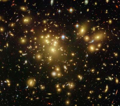 Abell 1689 cluster -- streaks are lensed distant galaxies behind the cluster