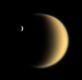 Titan with Enceladus in front